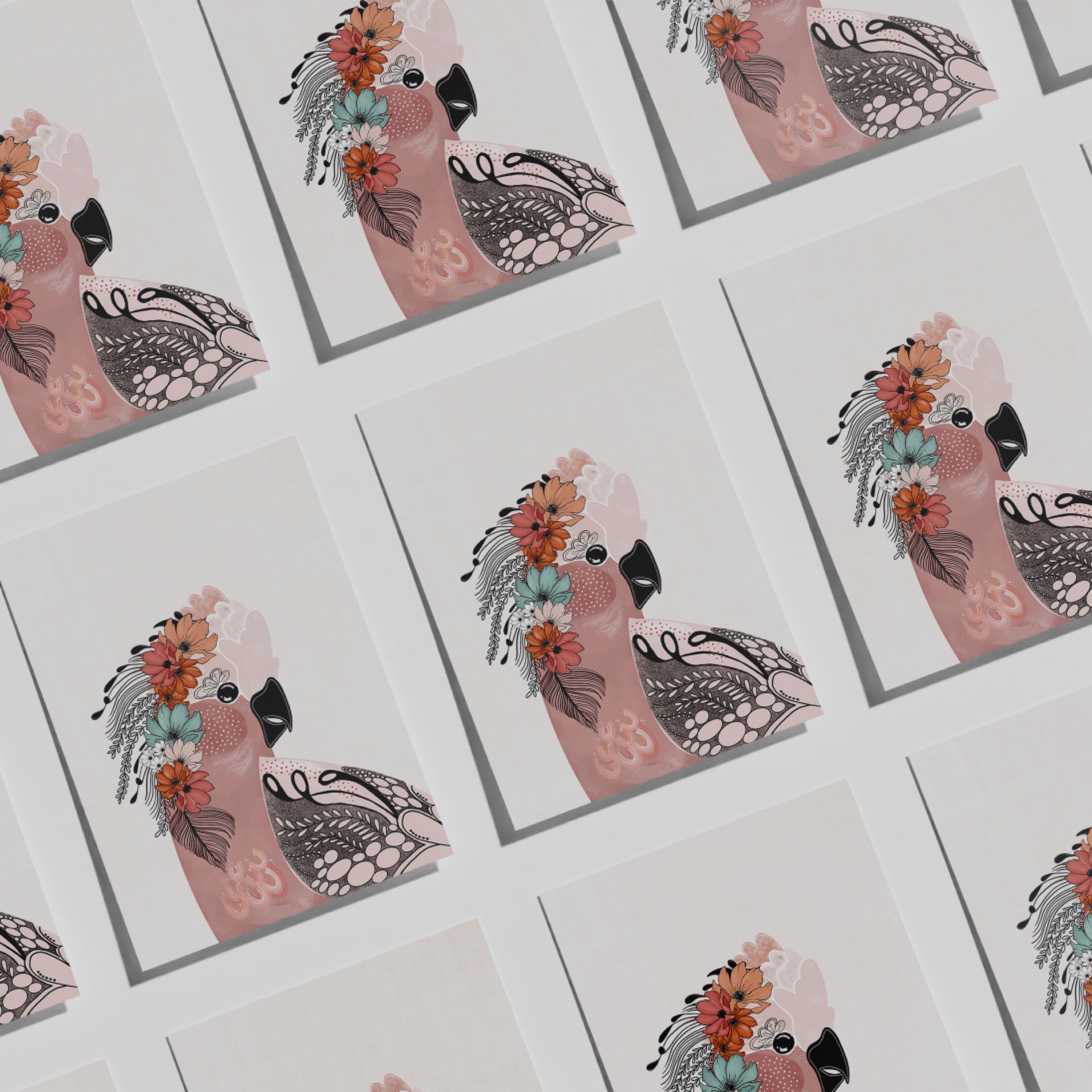 Matilda pink galah art print by Australian artist Rebecca A Moore shown as repeated unframed prints in a flat-lay arrangement